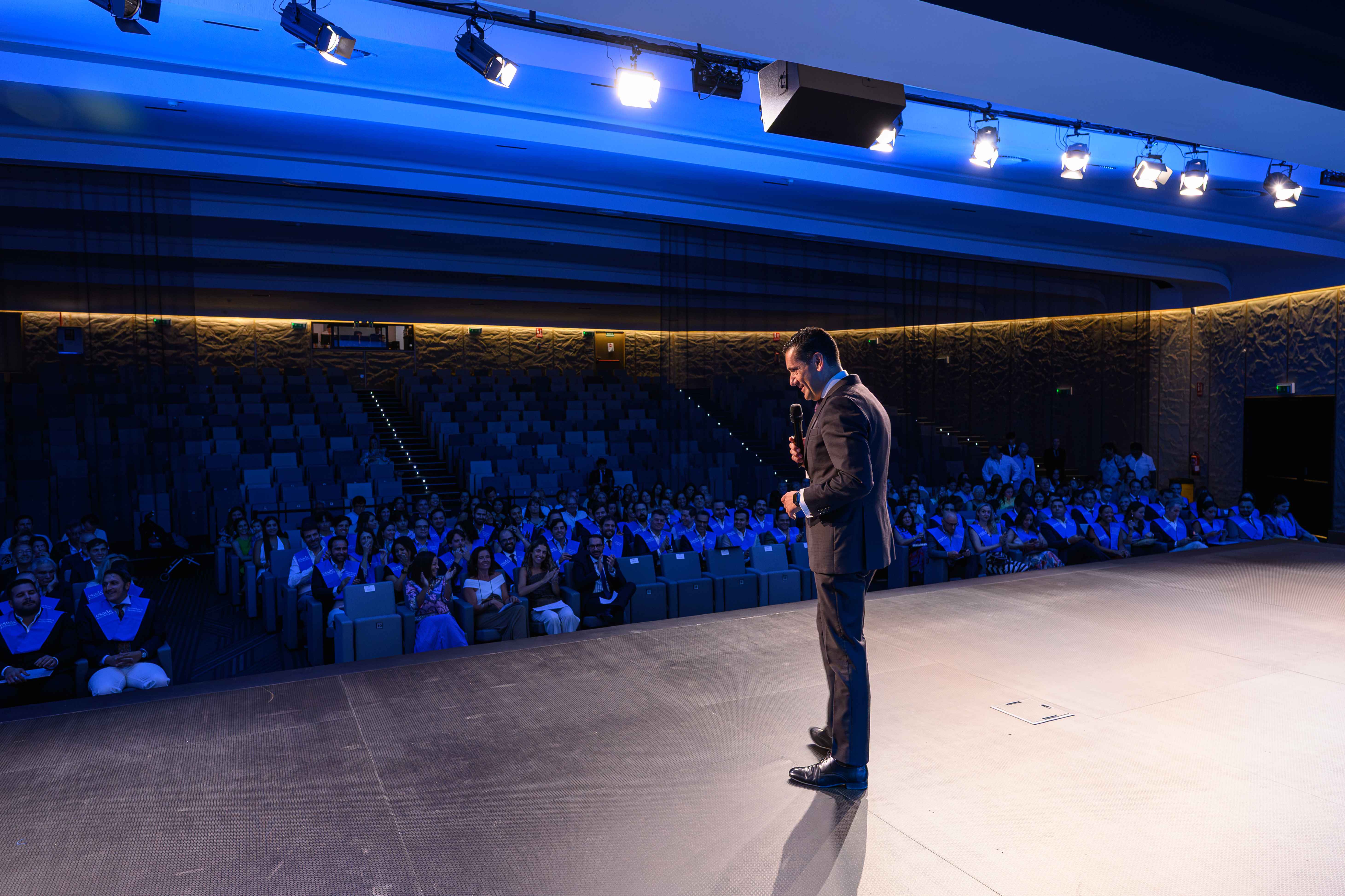 Santiago Minguez addressing the seated graduates from the stage during the 2026 ESADE Executive Masters Closing Ceremony in Madrid.