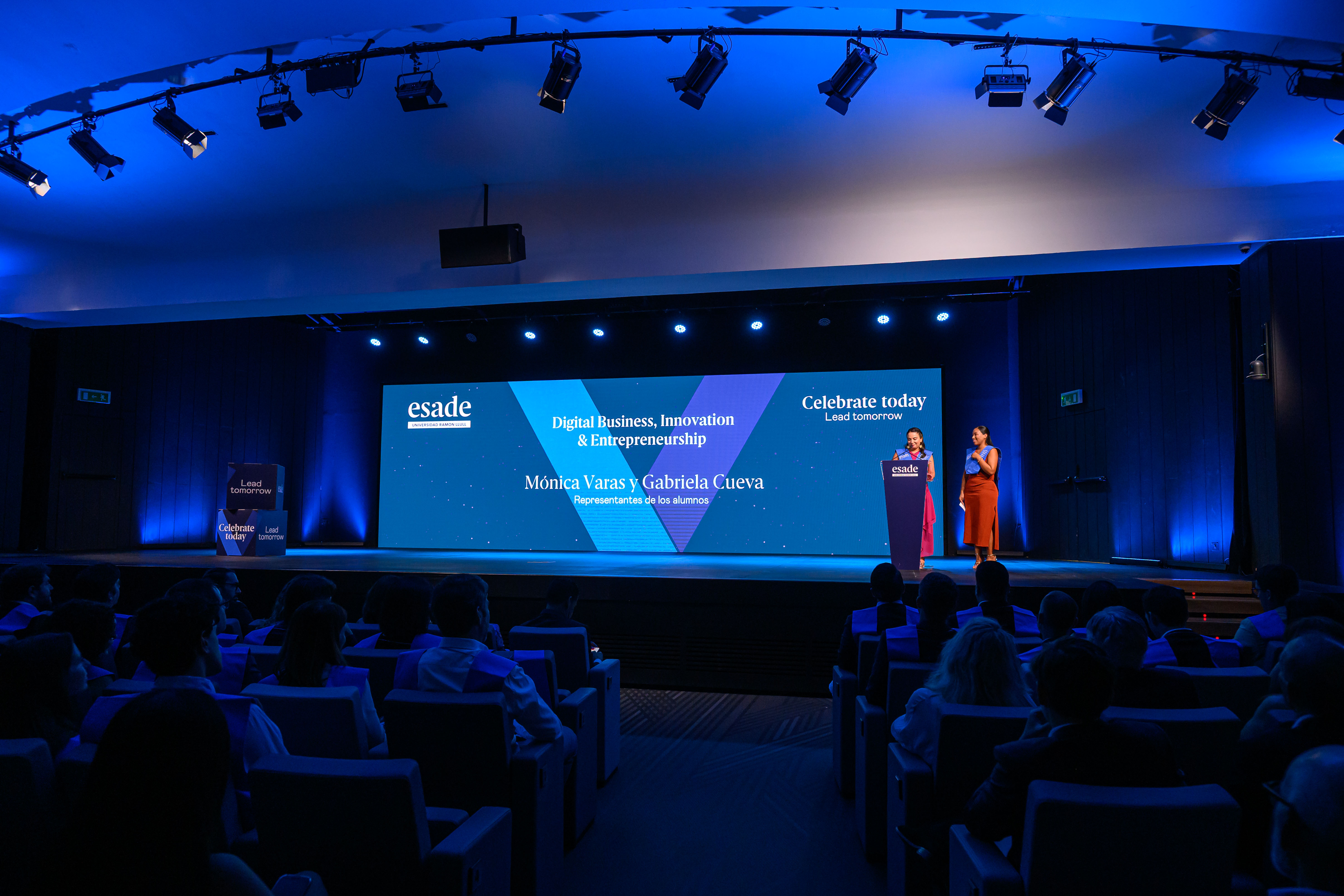 The Executive Master in Digital Business, Innovation & Entrepreneurship class representatives (Mónica Varas and Gabriela Cueva) speaking at the ESADE Closing Ceremony.