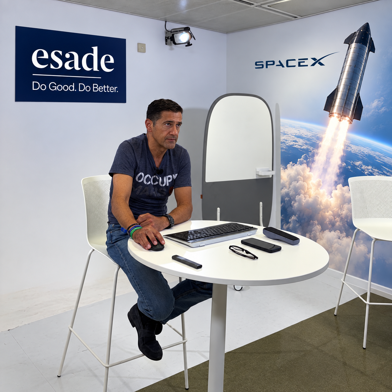 Santiago Minguez seated in an Esade classroom, beside a SpaceX Starship launch image.