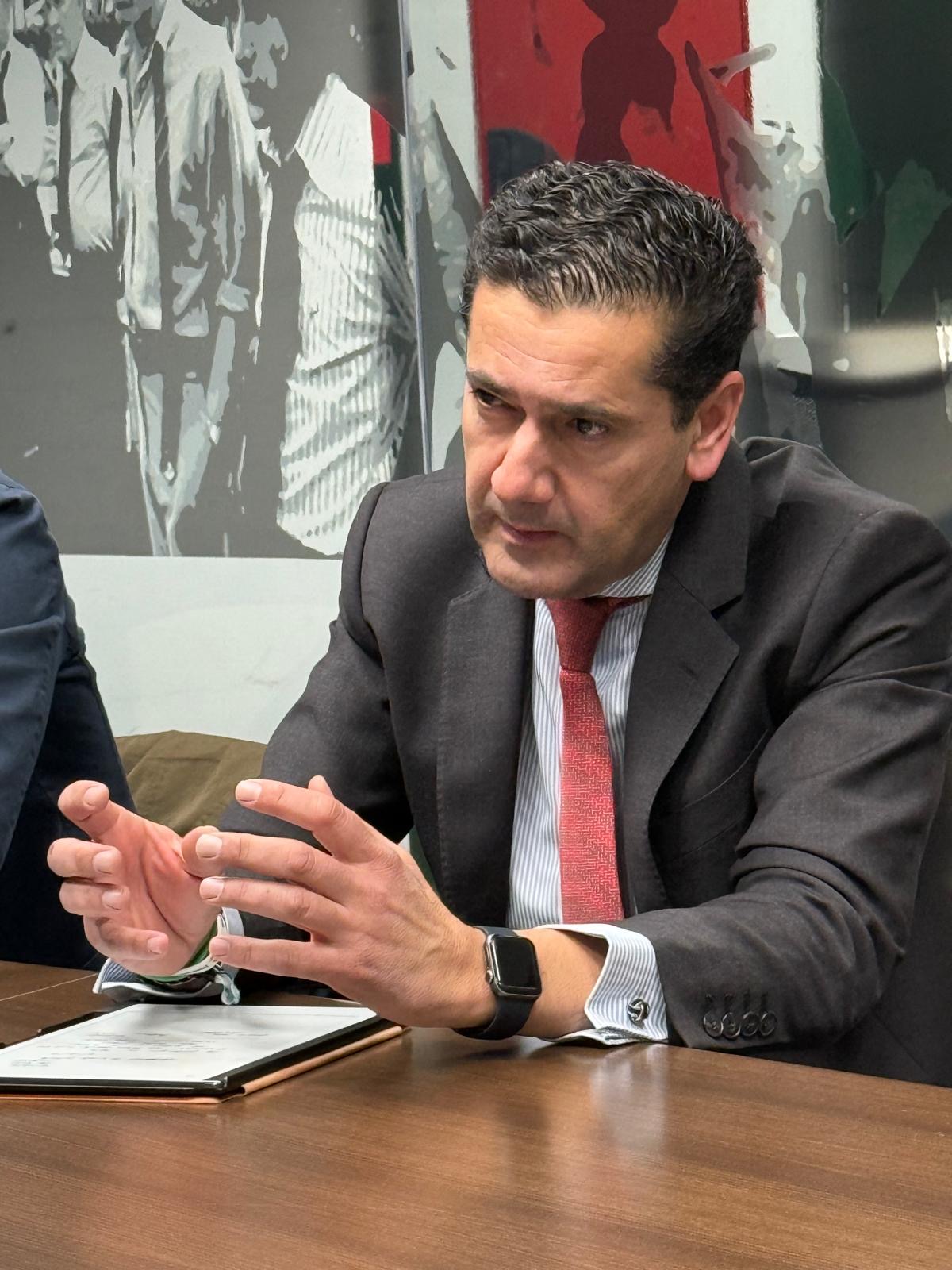 Santiago Minguez in conversation during a working meeting